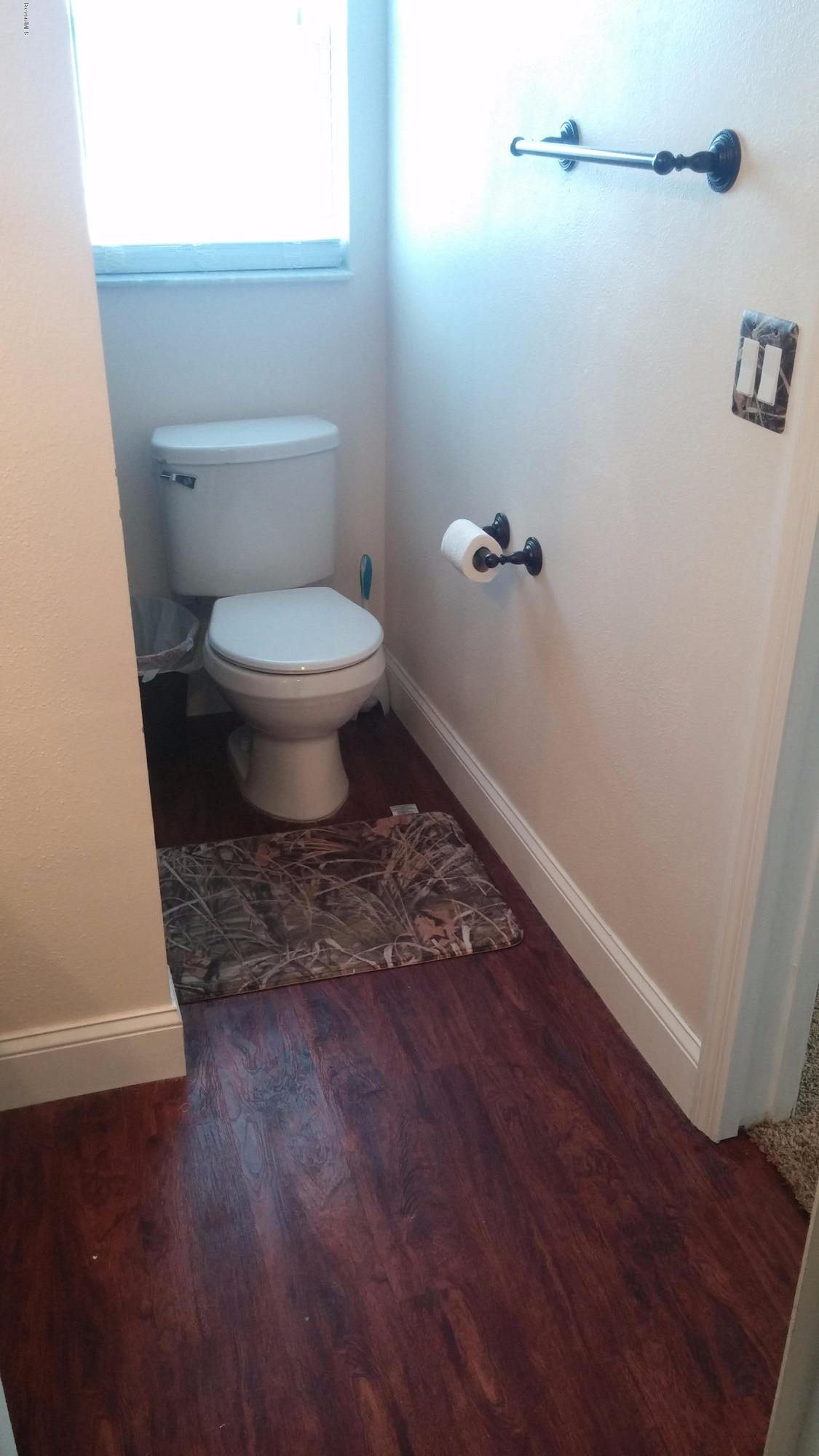 6950 Bryant Road Cocoa, FL 32927 - Photo 2 of 20 a bathroom with a toilet