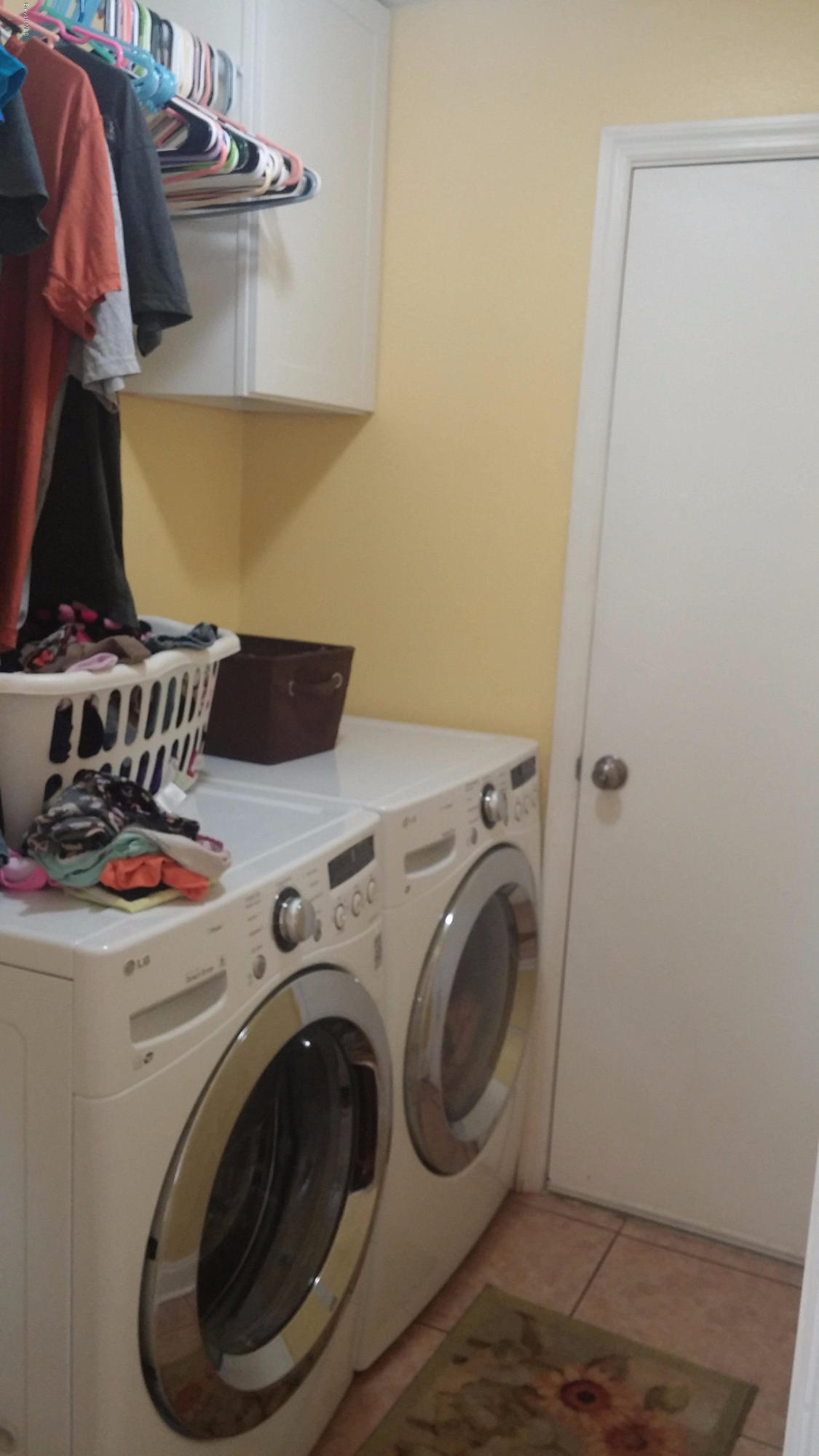 6950 Bryant Road Cocoa, FL 32927 - Photo 3 of 20 a utility room with dryer and washer