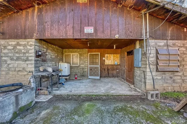 a view of a room with wooden walls