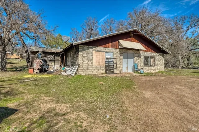 a view of a house with a yard porch and sitting area