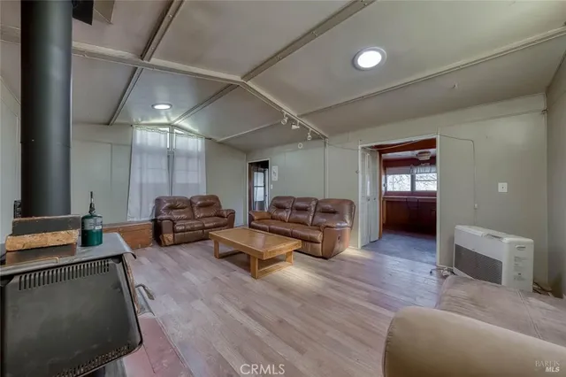 a kitchen with cabinets stainless steel appliances and a sink