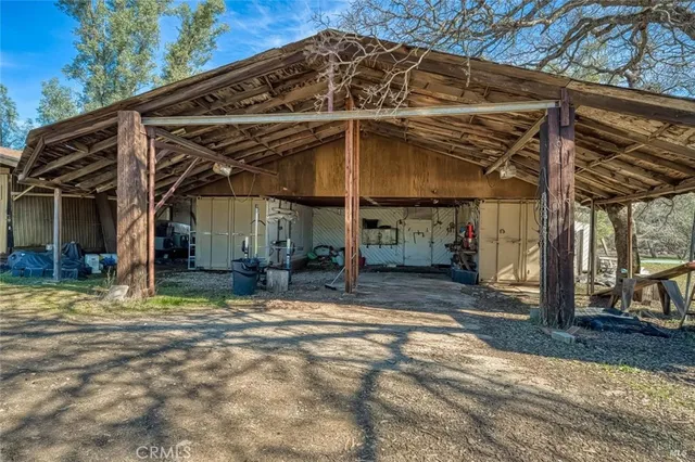 a view of a house with snow on the road