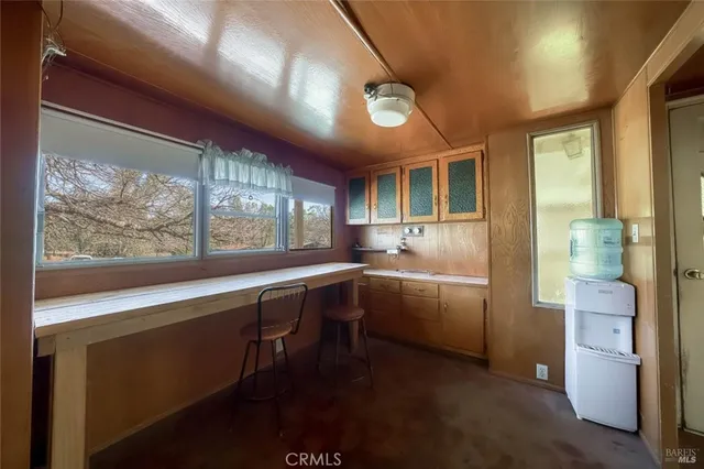 a hallway with a couch and wooden floor