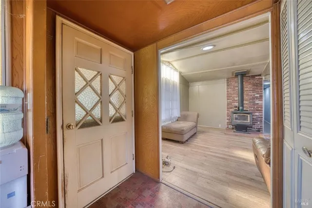 a room with a bed and dresser