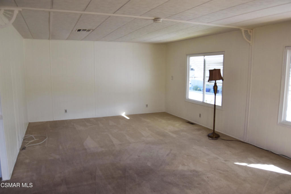 195 Tierra Rejada Road, Unit 197 Simi Valley, CA 93065 - Photo 3 of 28 an empty room with windows