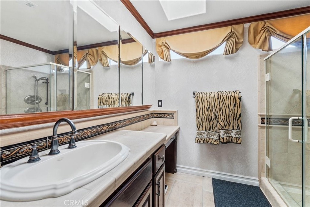 1506 Bergman Court Brea, CA 92821 - Photo 17 of 29 a bathroom with a sink a mirror and a shower