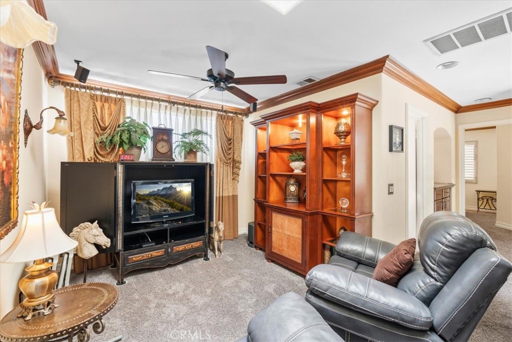 1506 Bergman Court Brea, CA 92821 - Photo 18 of 29 a living room with furniture a flat screen tv and a floor to ceiling window