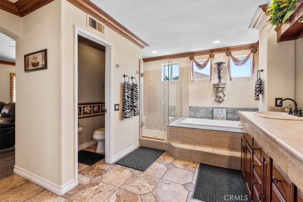 1506 Bergman Court Brea, CA 92821 - Photo 23 of 29 a spacious bathroom with a bathtub and a sink