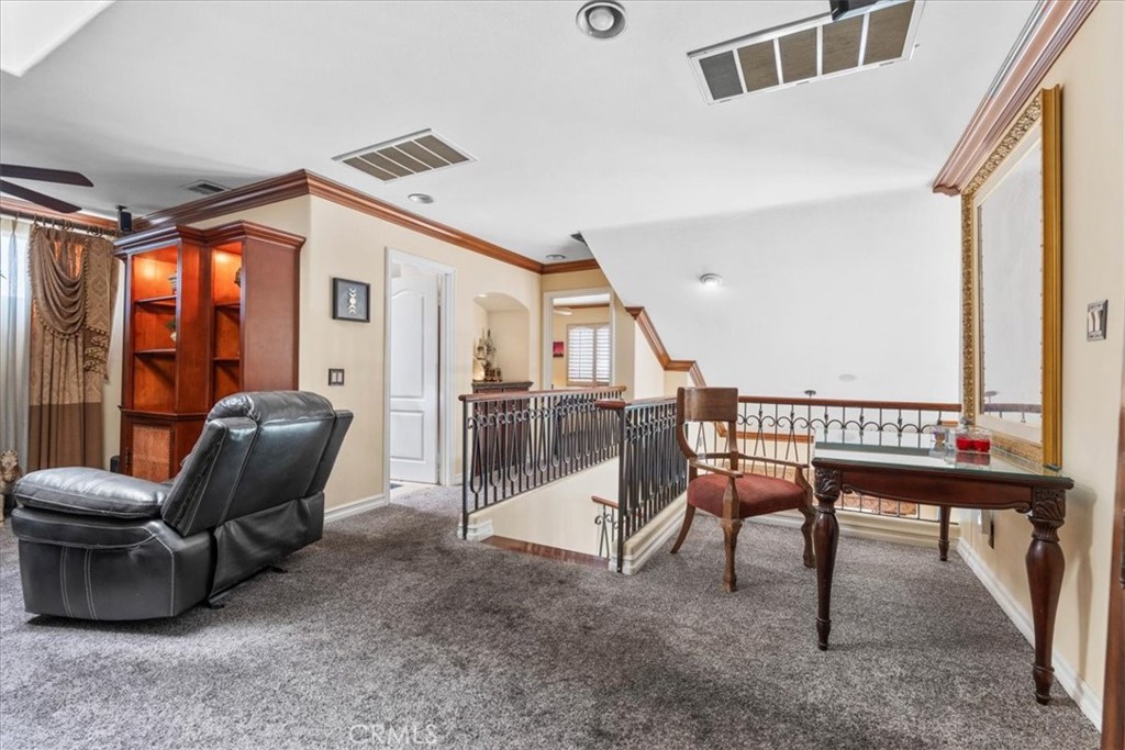 1506 Bergman Court Brea, CA 92821 - Photo 25 of 29 a living room with furniture a ceiling fan and a rug