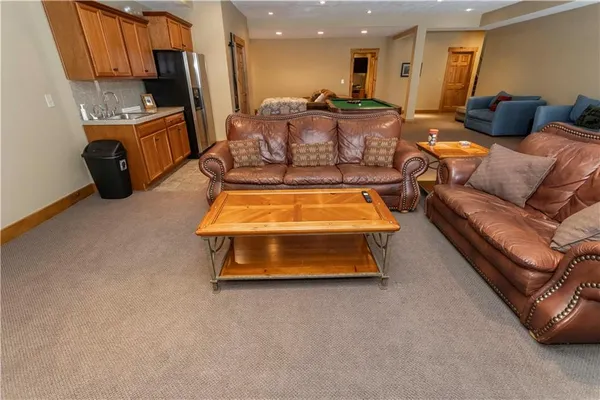 a room with furniture and a pool table