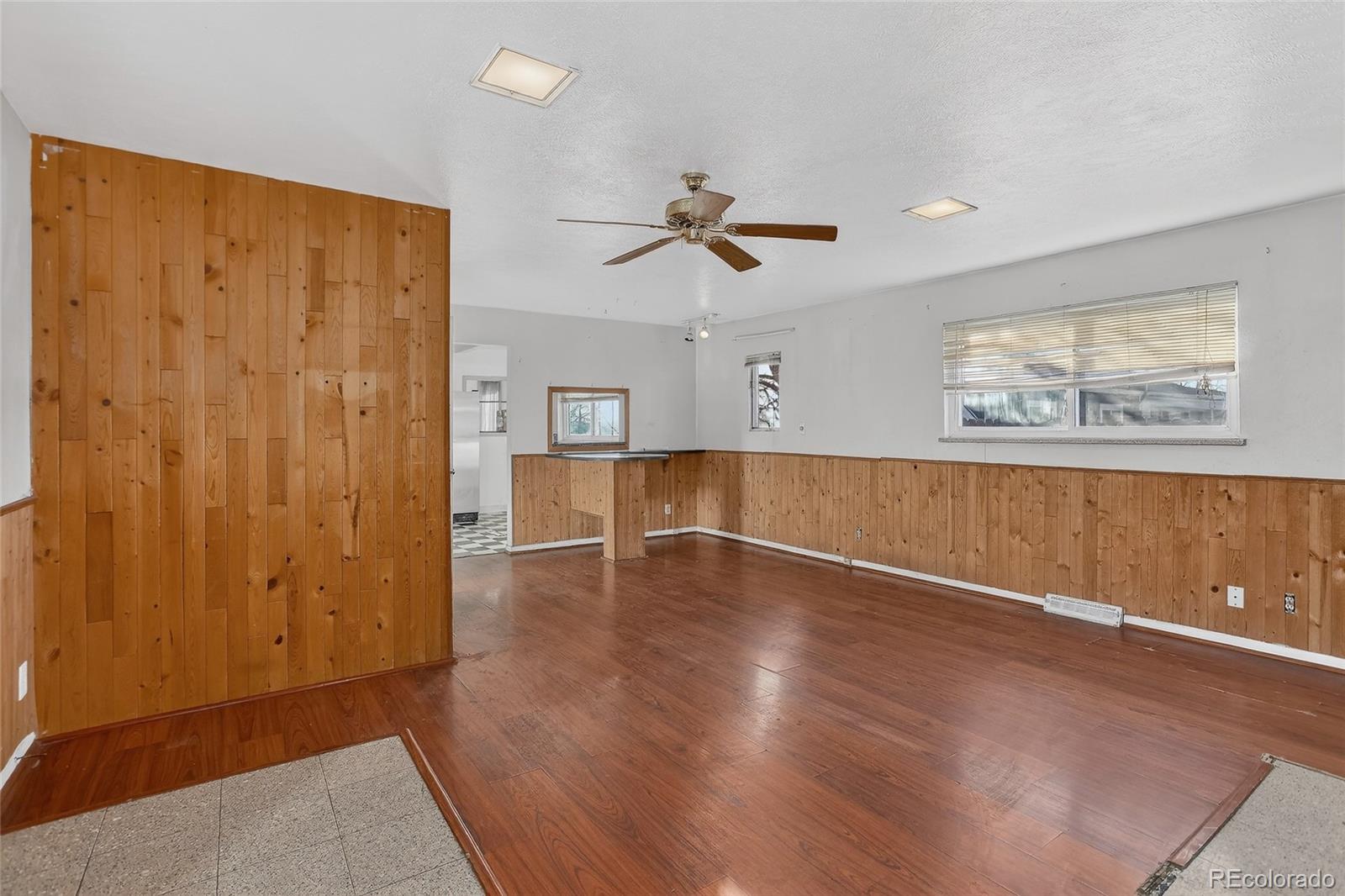 1279 South Raritan Street Denver, CO 80223 - Photo 12 of 21 wooden floor in an empty room with a window