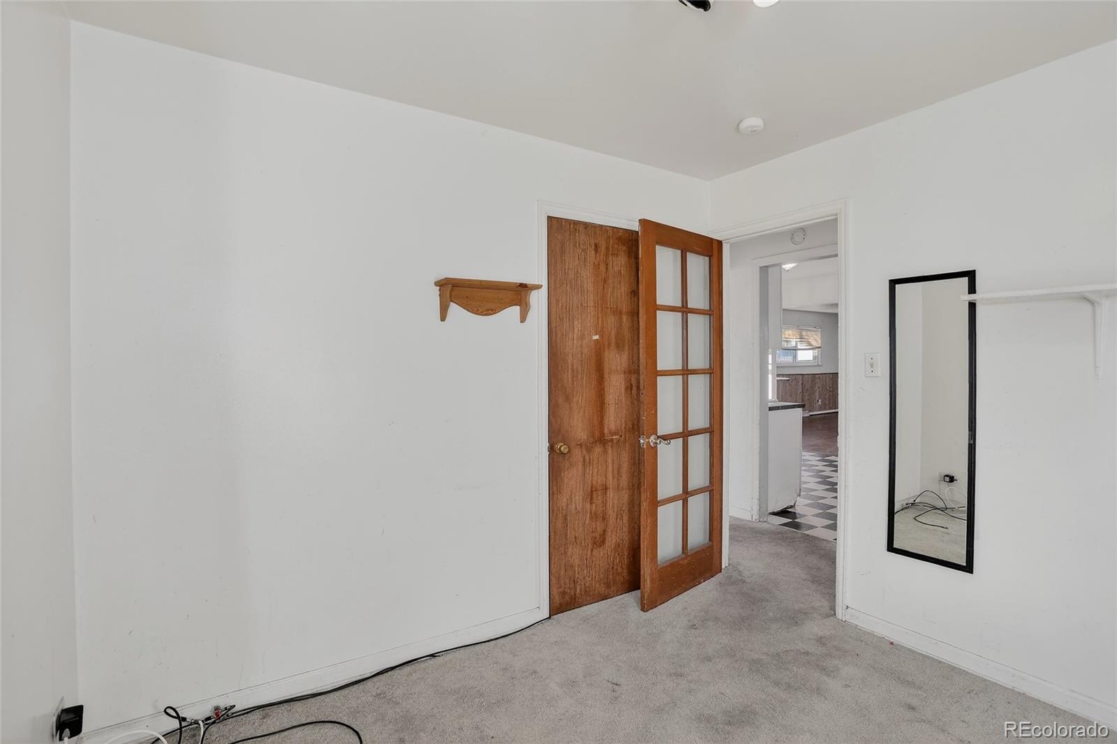 1279 South Raritan Street Denver, CO 80223 - Photo 18 of 21 wooden floor in an empty room