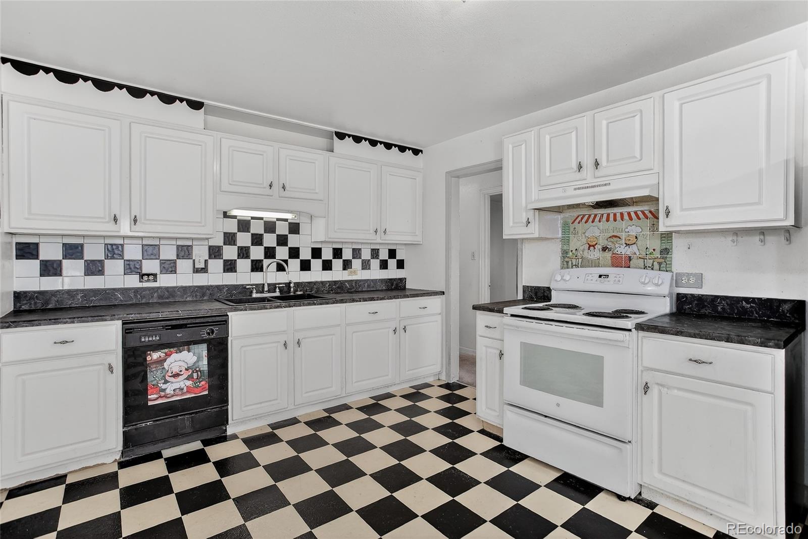 1279 South Raritan Street Denver, CO 80223 - Photo 10 of 21 a kitchen with granite countertop appliances a sink and cabinets