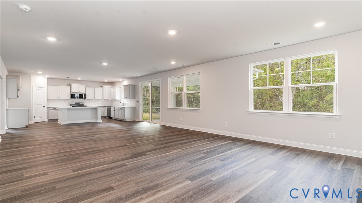 16943 Barmer Road Chesterfield, VA 23832 - Photo 12 of 39 an empty room with wooden floor and windows