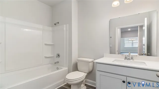 a bathroom with a sink toilet and bathtub