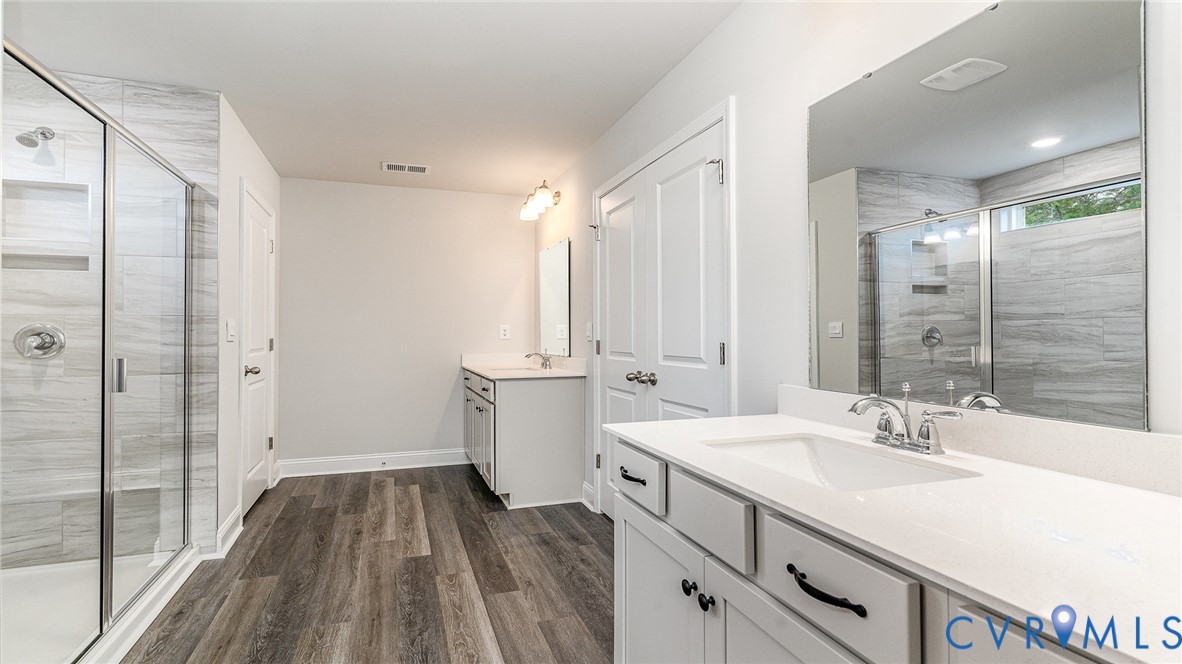 16943 Barmer Road Chesterfield, VA 23832 - Photo 32 of 39 a bathroom with a sink and a mirror