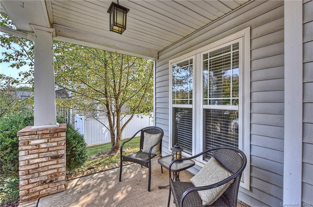 8905 Washam Potts Road Cornelius, NC 28031 - Photo 2 of 24 a roof deck with table and chairs and potted plants