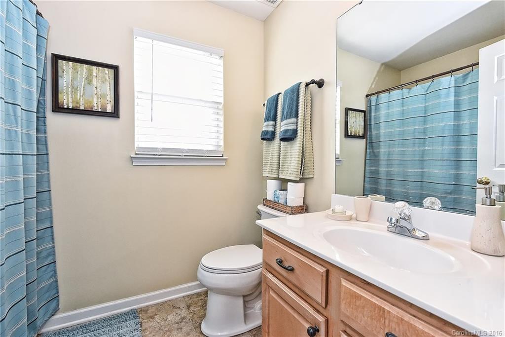 8905 Washam Potts Road Cornelius, NC 28031 - Photo 18 of 24 a bathroom with a sink toilet and shower