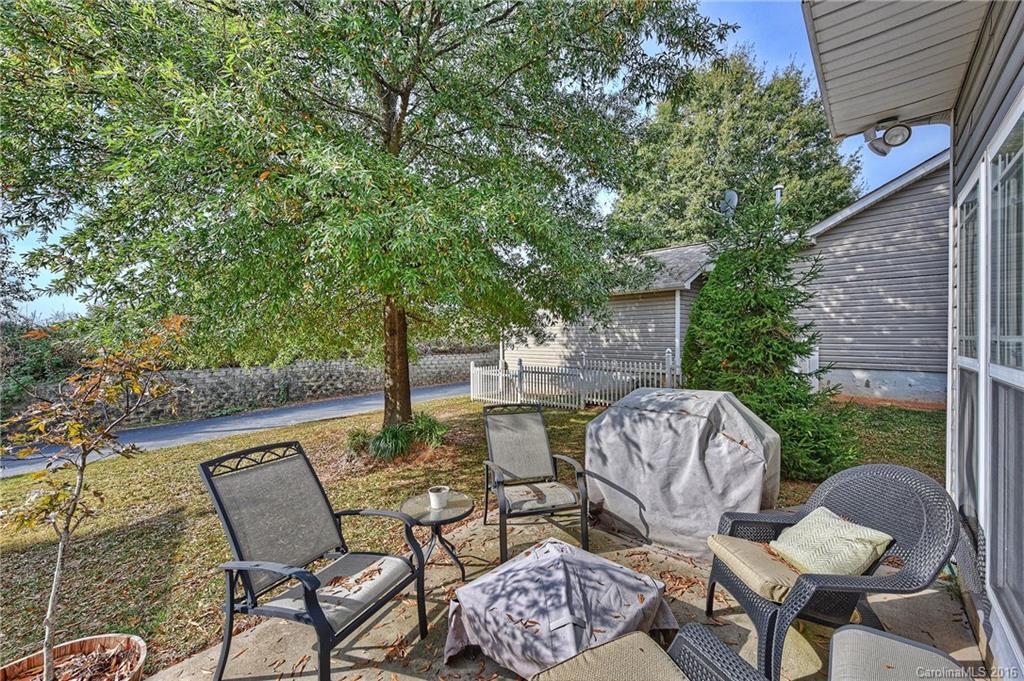 8905 Washam Potts Road Cornelius, NC 28031 - Photo 23 of 24 a view of an outdoor sitting area with furniture and wooden floor