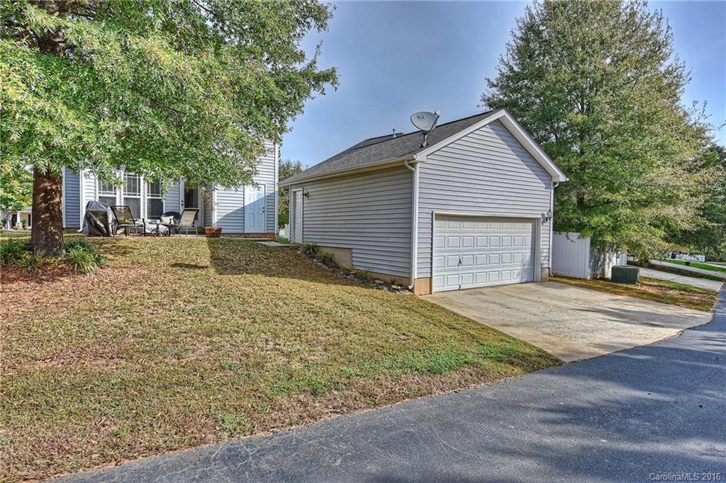 8905 Washam Potts Road Cornelius, NC 28031 - Photo 24 of 24 a front view of a house with a yard and garage