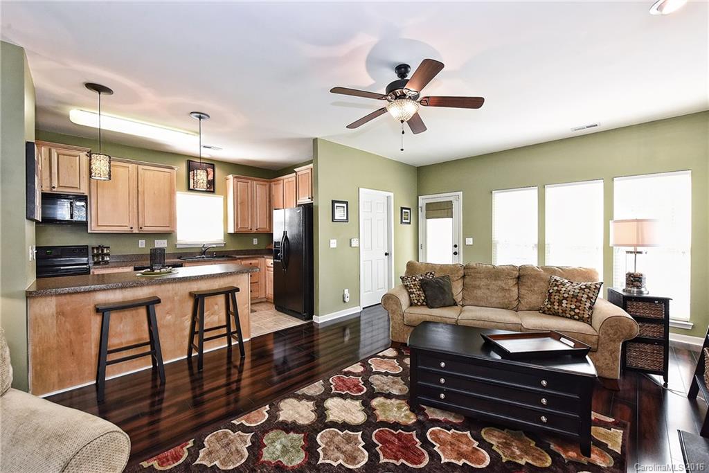 8905 Washam Potts Road Cornelius, NC 28031 - Photo 10 of 24 a living room with furniture and a large window