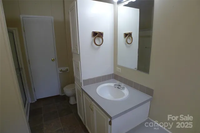 a bathroom with a sink and mirror