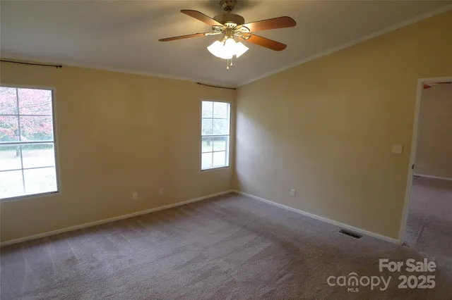 a view of empty room with a fireplace