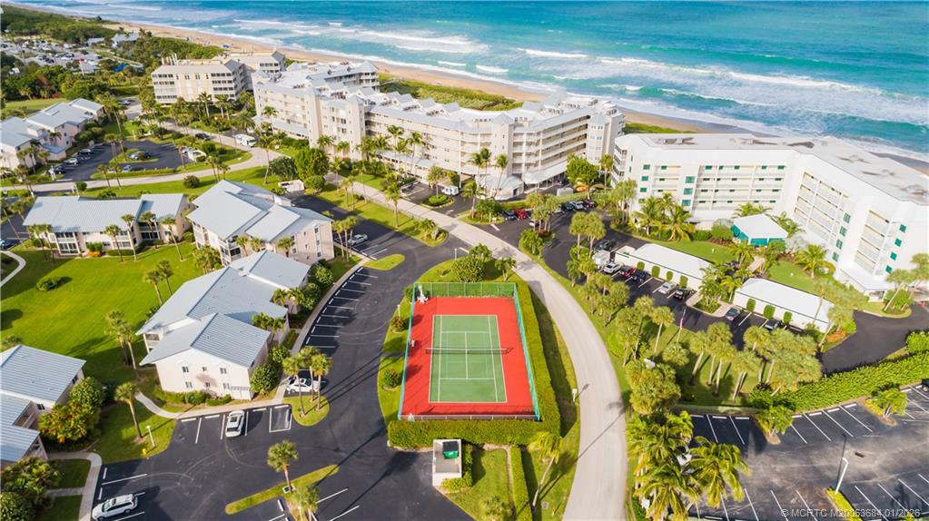 579 Northeast Plantation Road, Unit N202 Jensen Beach, FL 34957 - Photo 11 of 42 an aerial view of residential houses with outdoor space