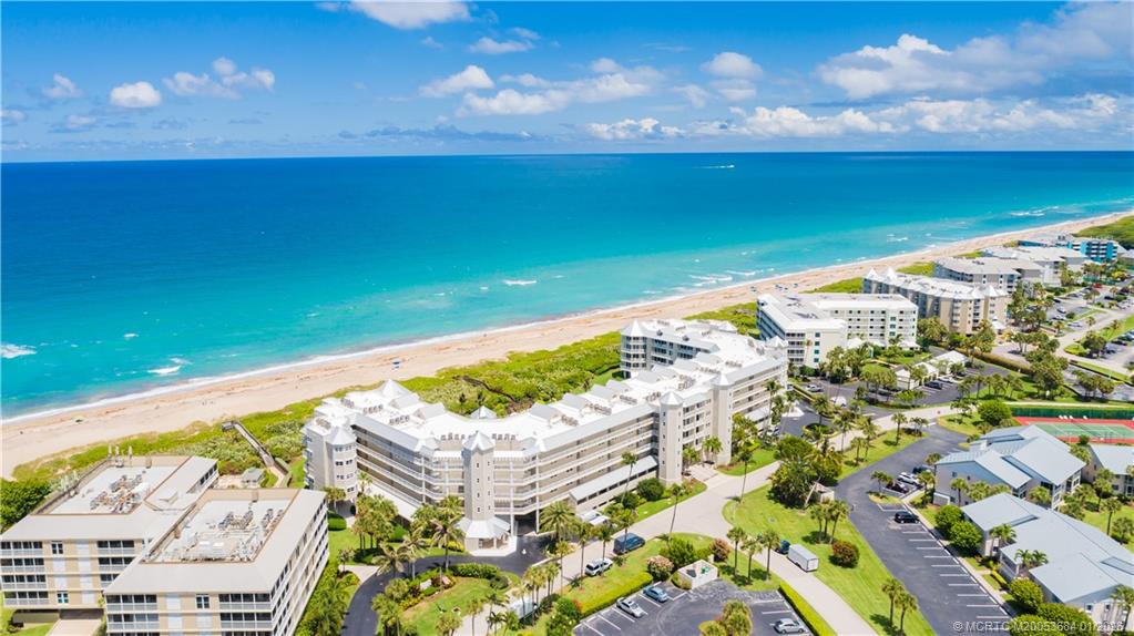579 Northeast Plantation Road, Unit N202 Jensen Beach, FL 34957 - Photo 2 of 42 a view of an ocean from a balcony