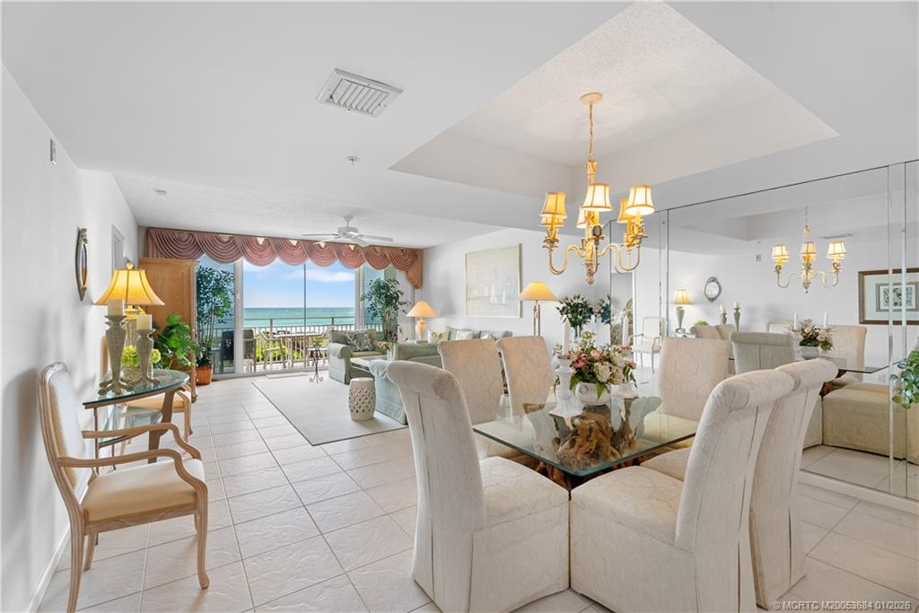 579 Northeast Plantation Road, Unit N202 Jensen Beach, FL 34957 - Photo 29 of 42 a view of a dining room with furniture window and outside view
