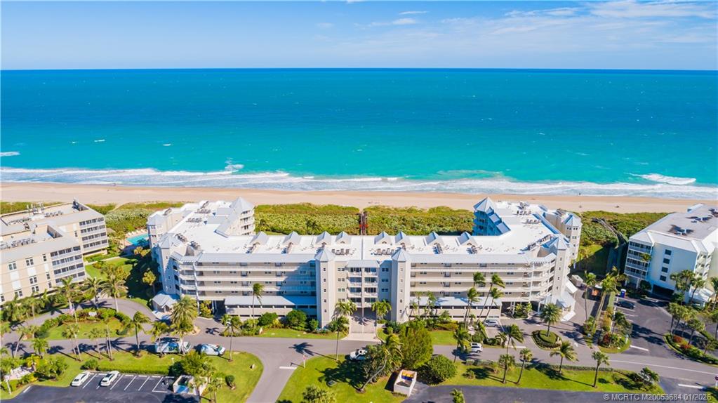 579 Northeast Plantation Road, Unit N202 Jensen Beach, FL 34957 - Photo 3 of 42 a view of a city with an ocean view