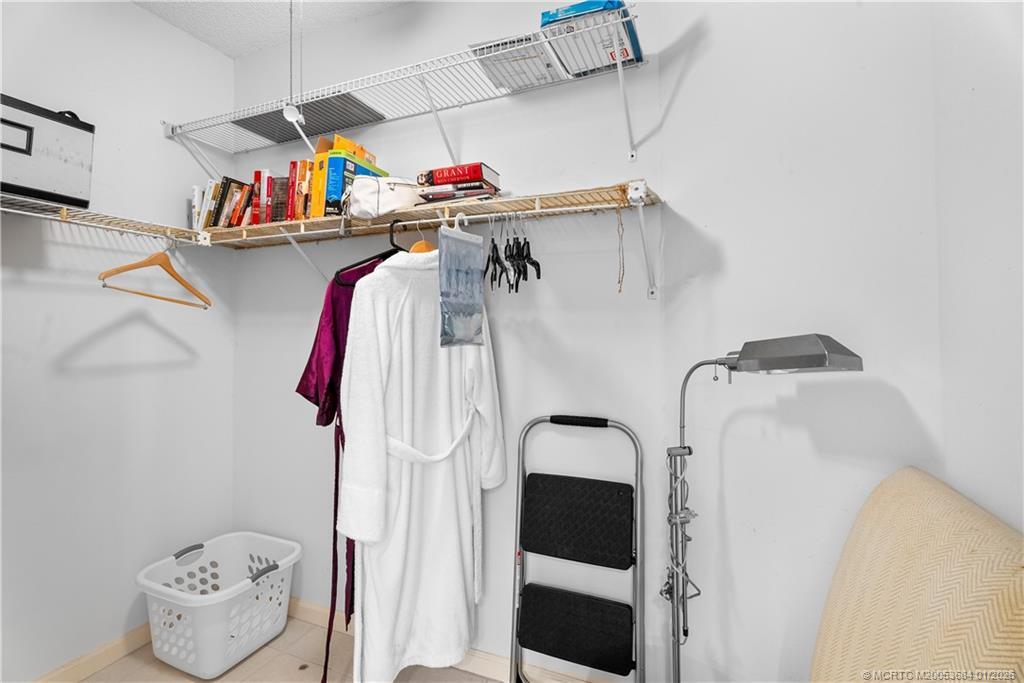 579 Northeast Plantation Road, Unit N202 Jensen Beach, FL 34957 - Photo 36 of 42 a utility room with dryer and washer