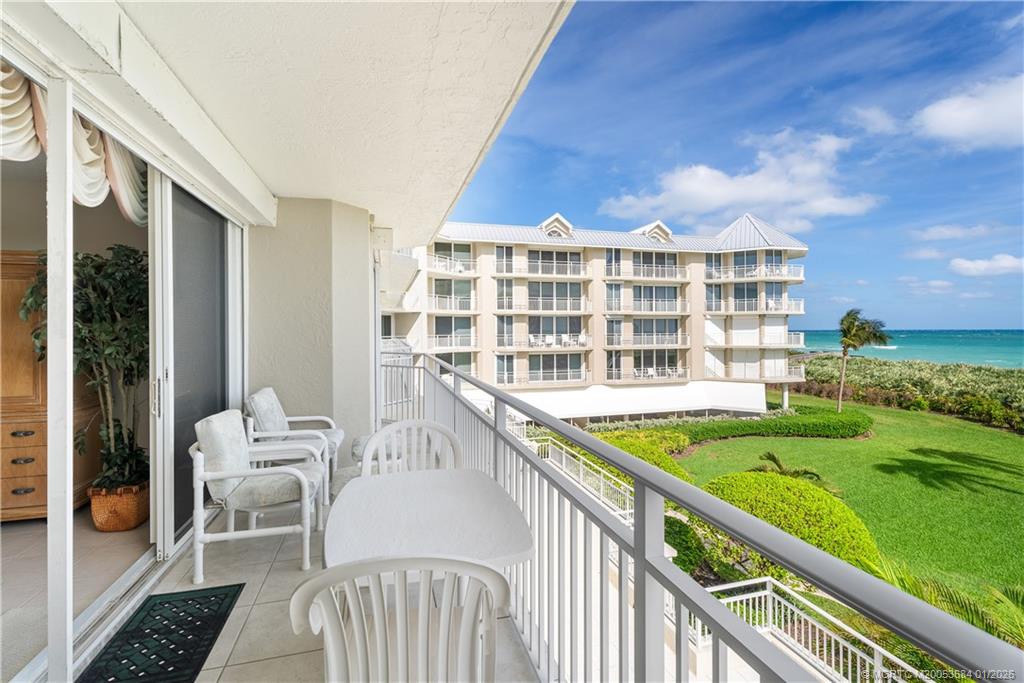 579 Northeast Plantation Road, Unit N202 Jensen Beach, FL 34957 - Photo 40 of 42 a view of a balcony with chairs