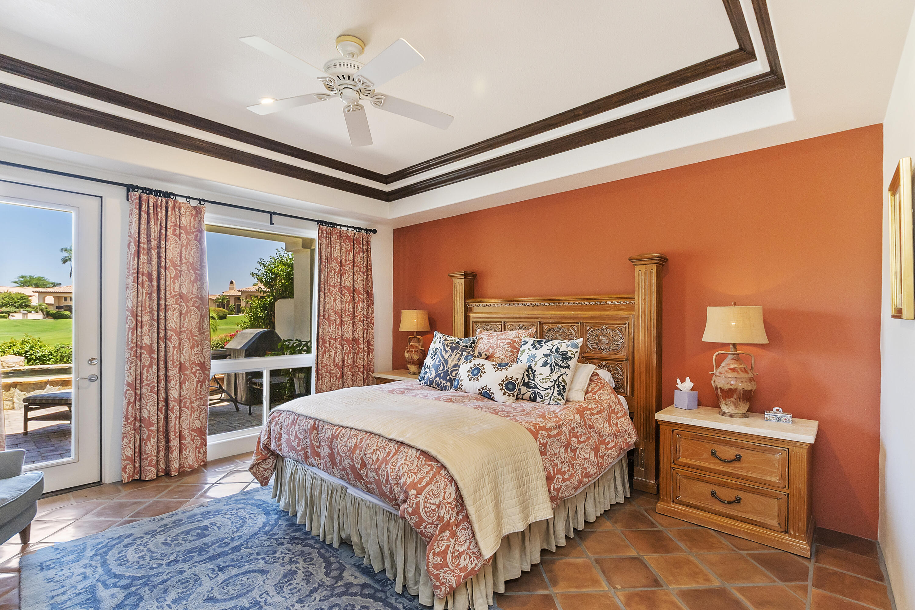 78920 Cabrillo Way La Quinta, CA 92253 - Photo 15 of 41 a bedroom with a bed and a chandelier