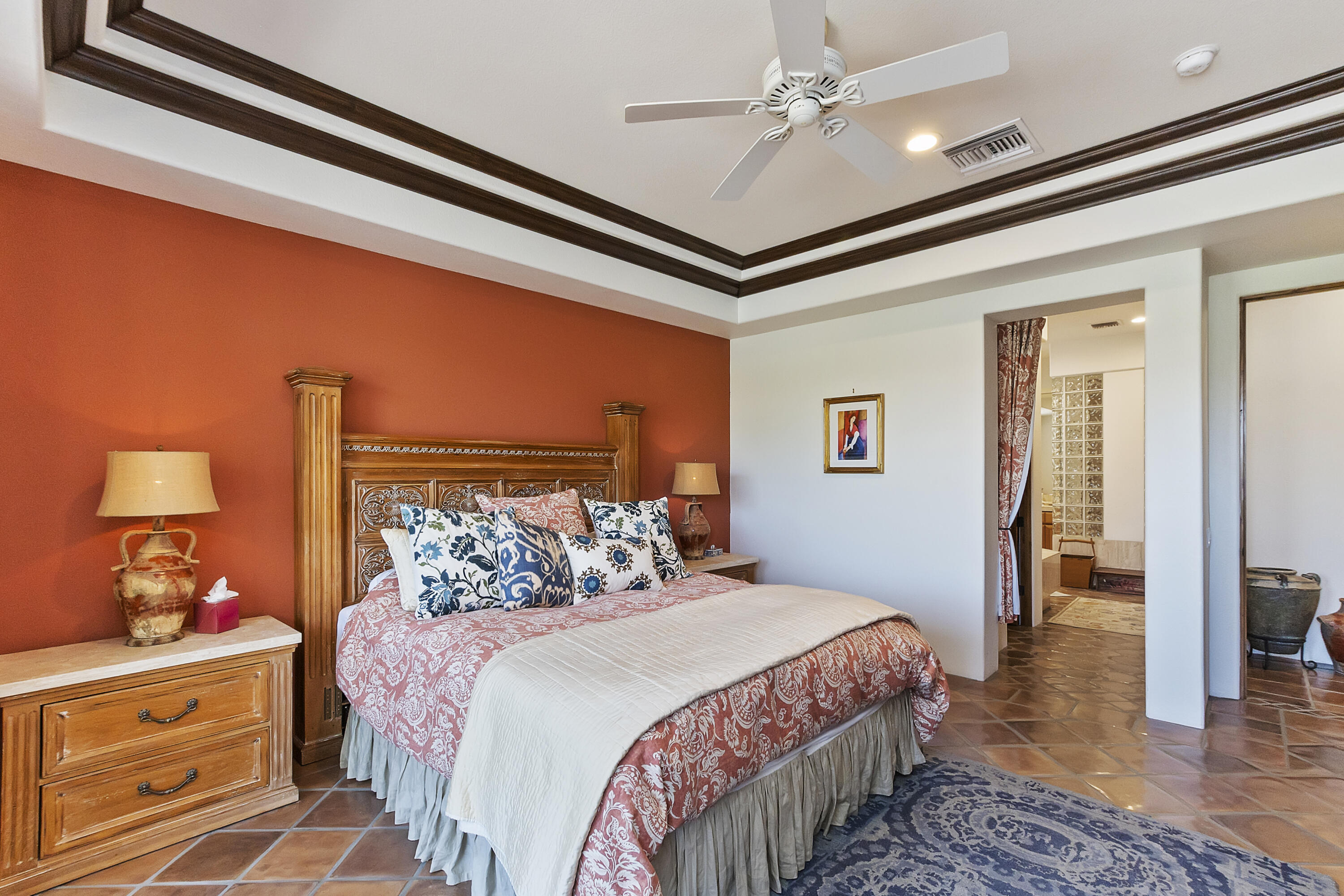78920 Cabrillo Way La Quinta, CA 92253 - Photo 16 of 41 a bedroom with a bed and a lamp on dresser