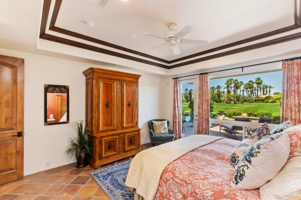 a bed room with a bed and a television