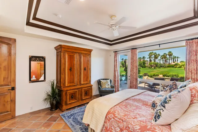 a bed room with a bed and a television