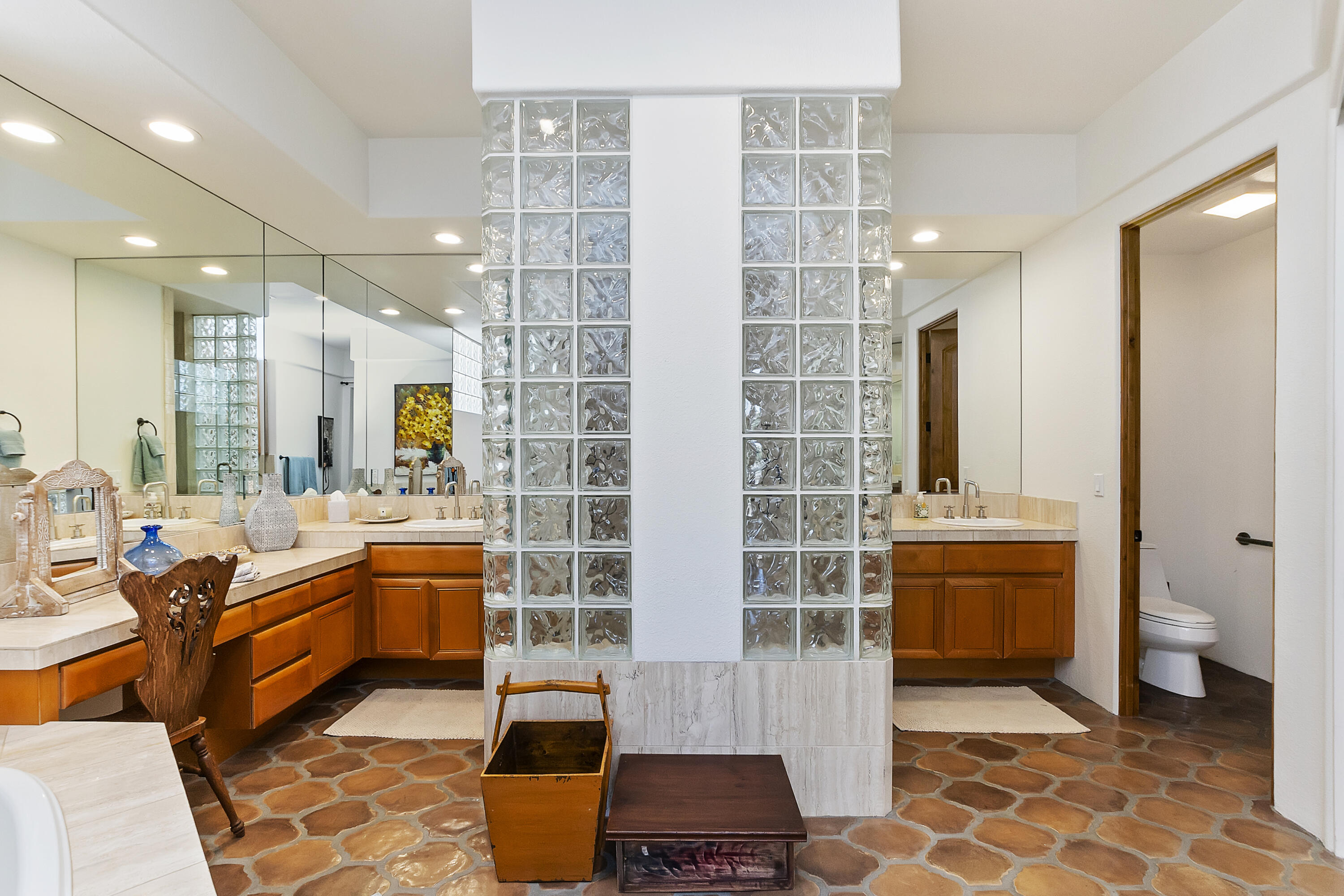 78920 Cabrillo Way La Quinta, CA 92253 - Photo 18 of 41 a bathroom with a double vanity sink a toilet and shower
