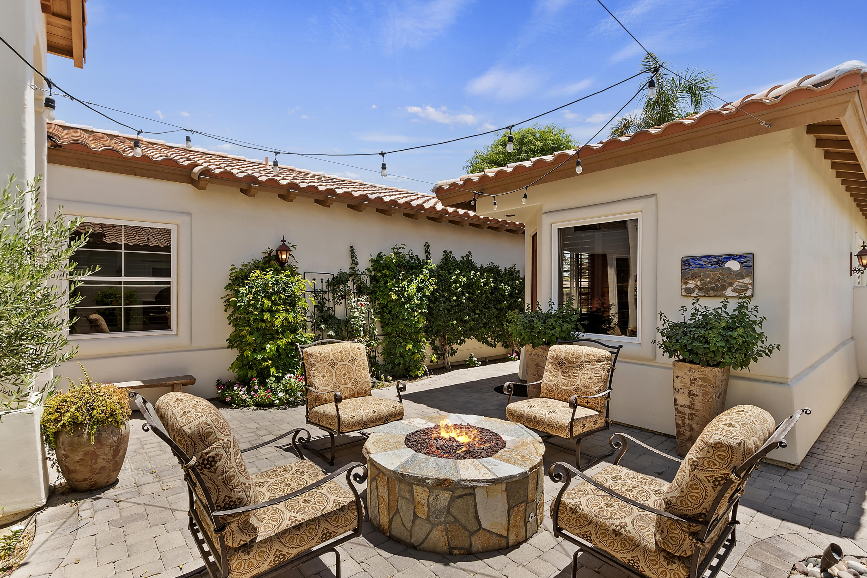 78920 Cabrillo Way La Quinta, CA 92253 - Photo 2 of 41 a view of a patio with couches table and chairs and potted plants