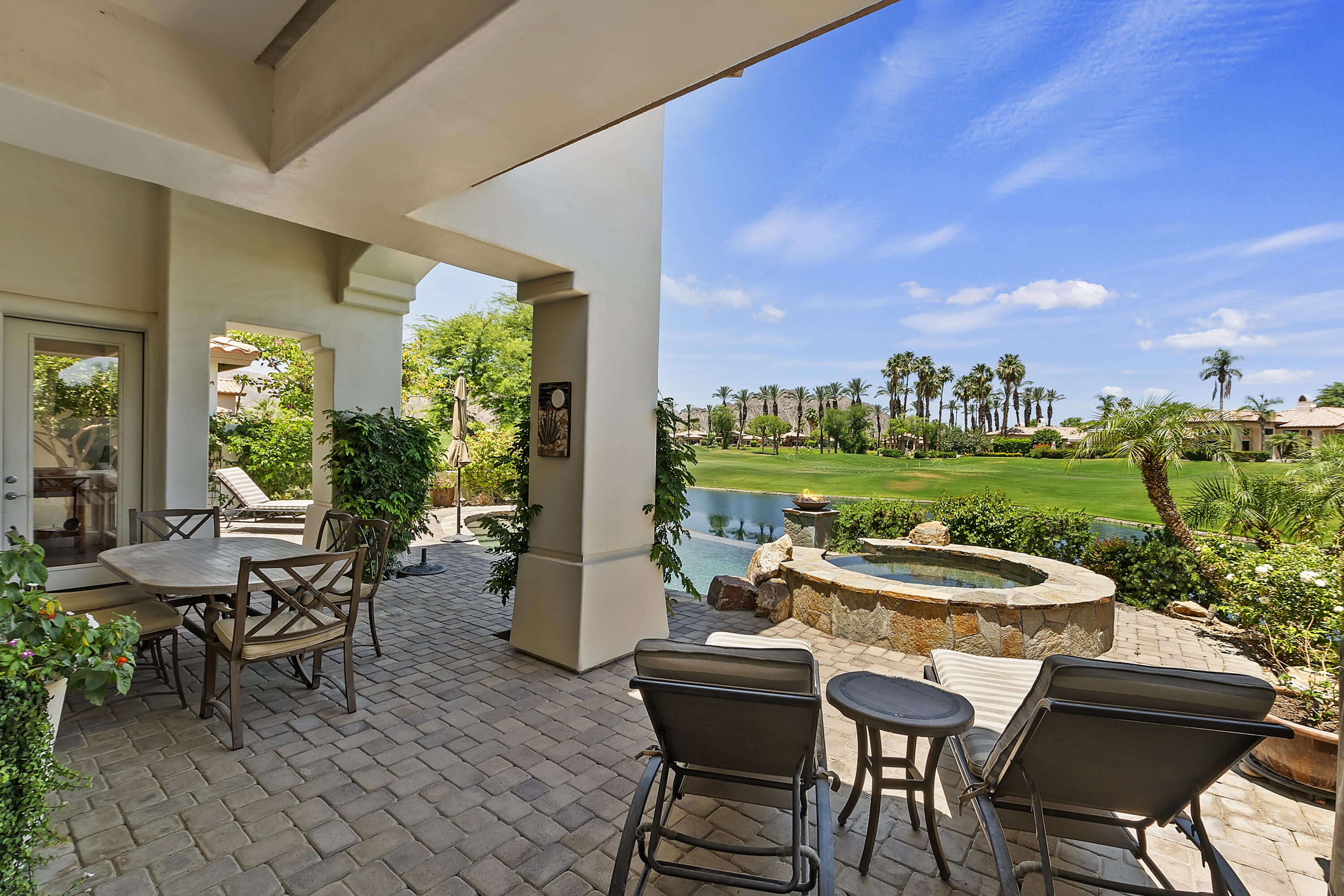 78920 Cabrillo Way La Quinta, CA 92253 - Photo 26 of 41 a view of a patio with table and chairs and potted plants