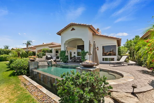 a view of a lake with a house in the background