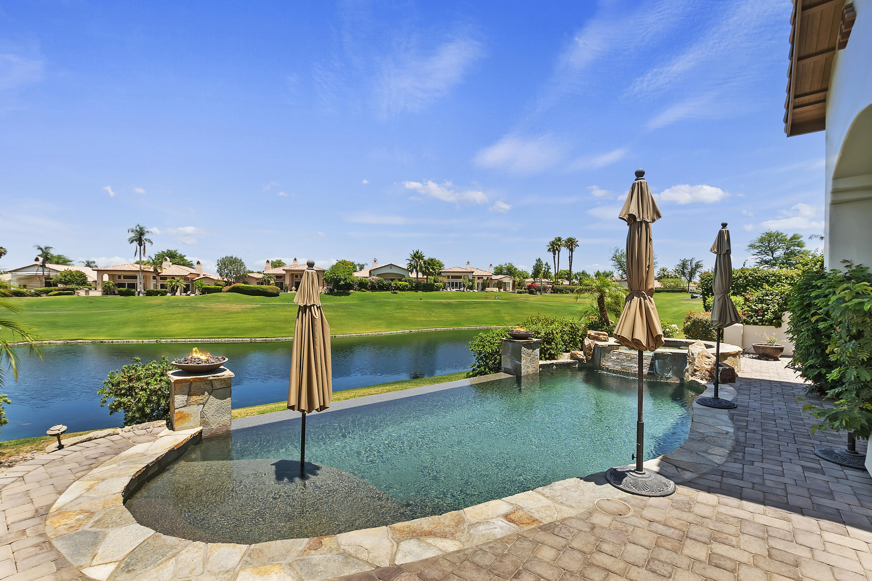 78920 Cabrillo Way La Quinta, CA 92253 - Photo 30 of 41 a view of a lake with a house in the background