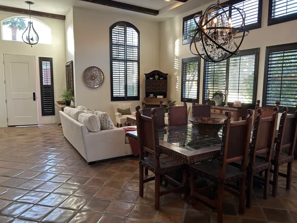 a living room with fireplace furniture and windows