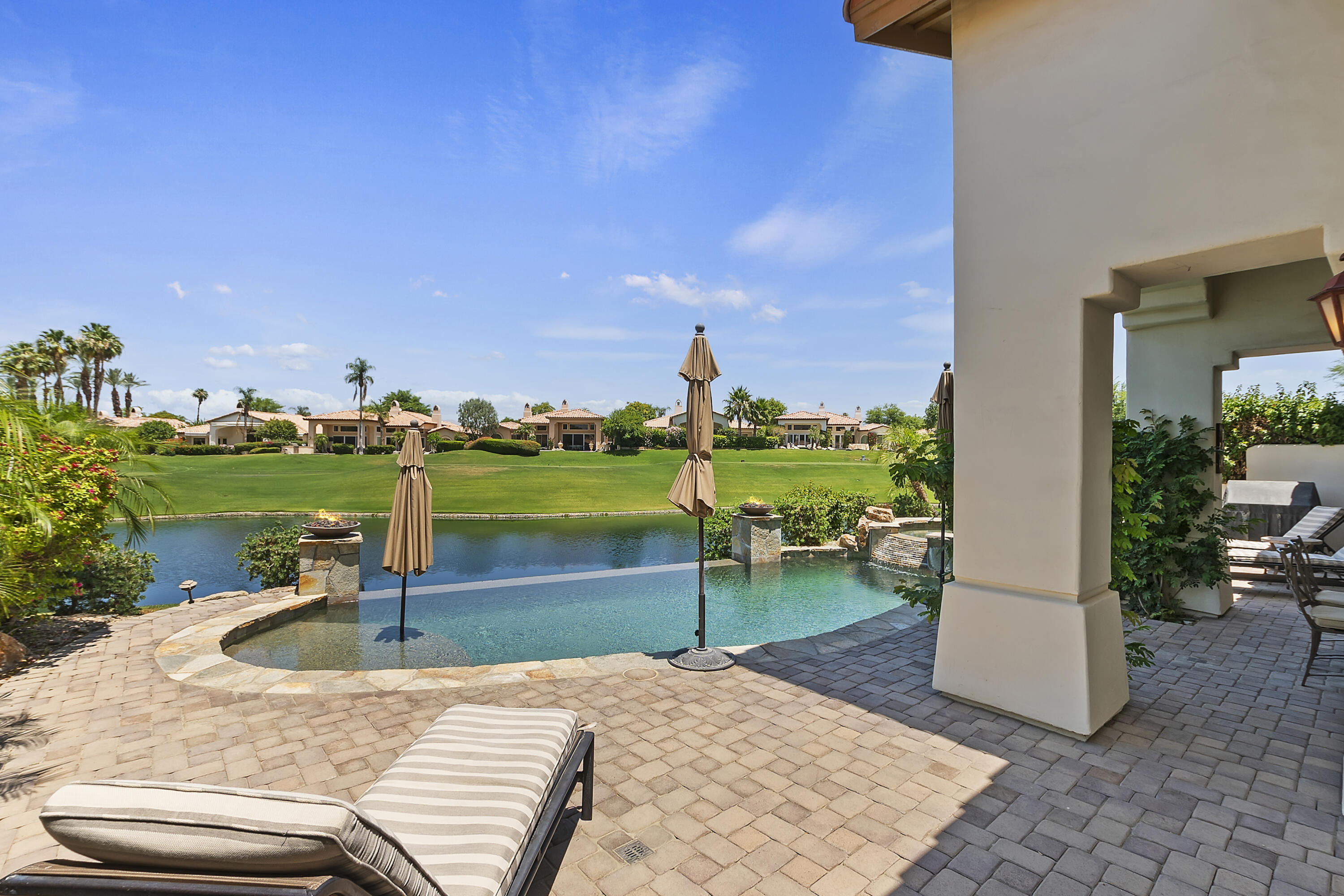 78920 Cabrillo Way La Quinta, CA 92253 - Photo 31 of 41 a view of a swimming pool and a yard