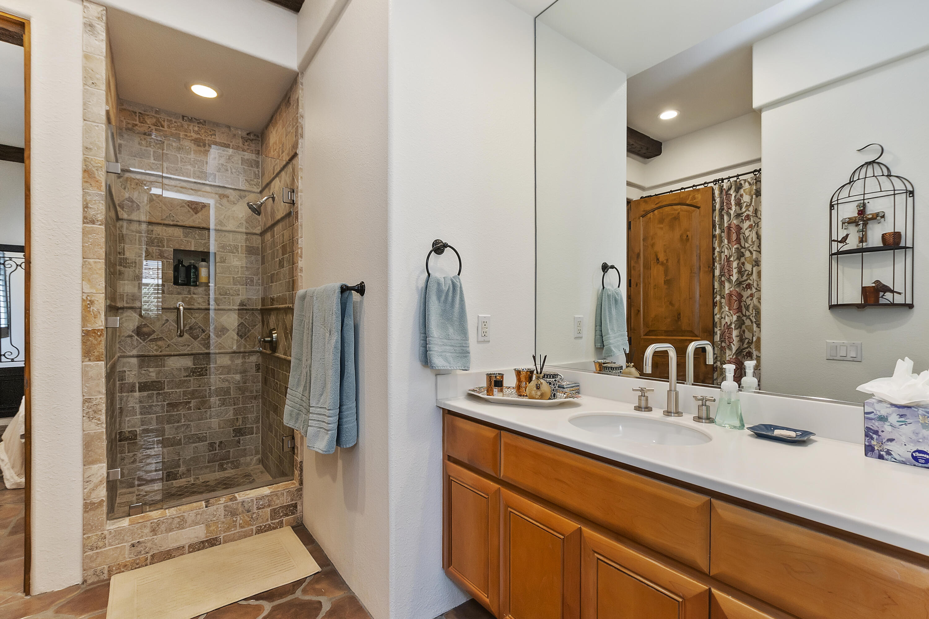 78920 Cabrillo Way La Quinta, CA 92253 - Photo 39 of 41 a bathroom with a shower sink and mirror