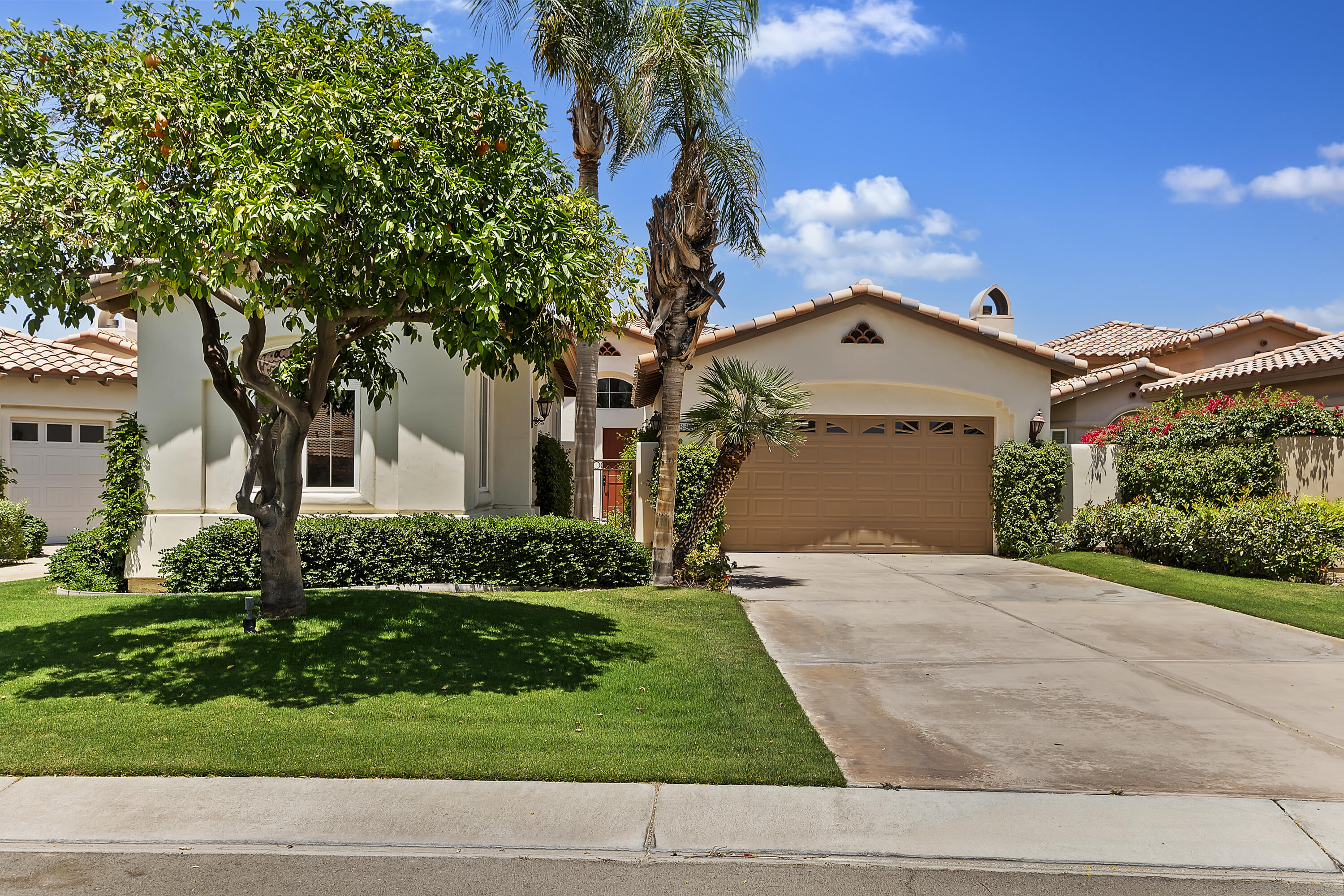 78920 Cabrillo Way La Quinta, CA 92253 - Photo 40 of 41 a front view of a house with a yard and garage