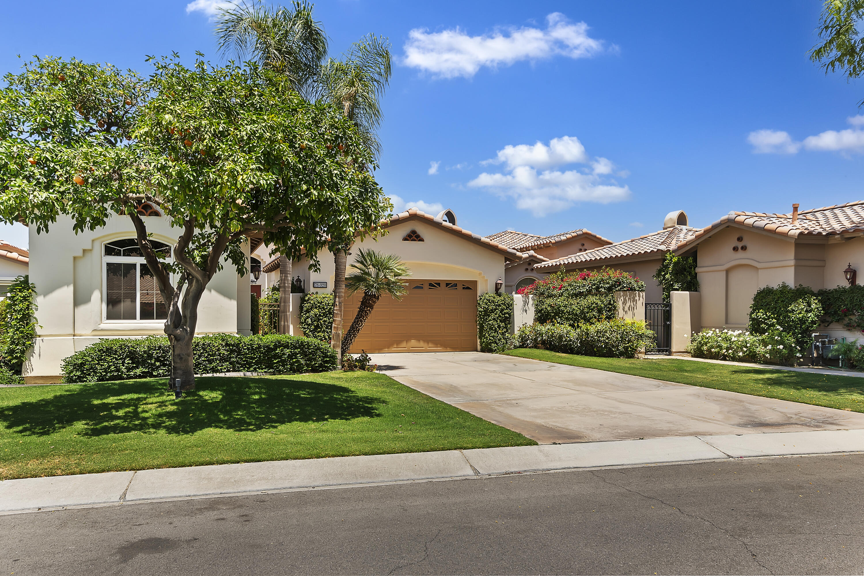 78920 Cabrillo Way La Quinta, CA 92253 - Photo 41 of 41 a front view of a house with a yard and a garage
