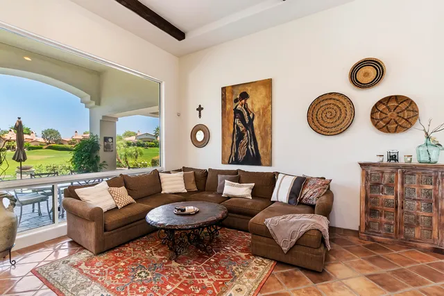 a living room with furniture and a table
