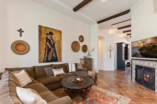 a living room with furniture and a fireplace