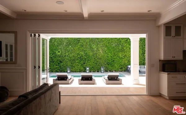 a view of living room with furniture and a large window